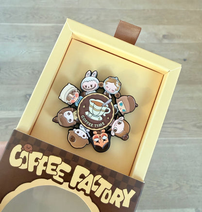 POP BEAN Coffee Factory Badge showing rotatable lower alloy piece mechanism