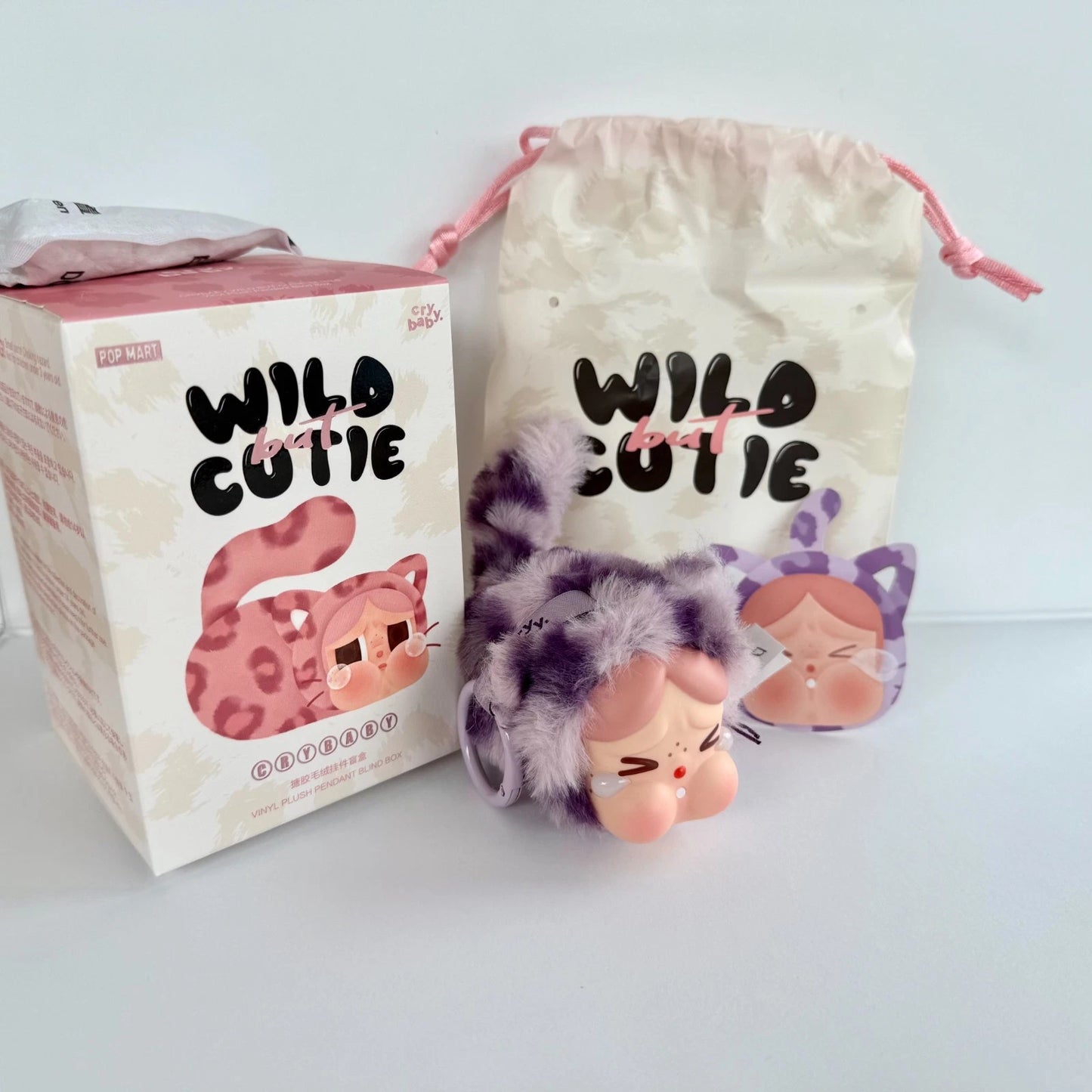 CRYBABY Wild but Cutie series blind box with original POP MART packaging, plush pendant and drawstring pouch neon cutie