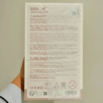 Back view of Labubu Wacky Mart packaging with official product details and materials